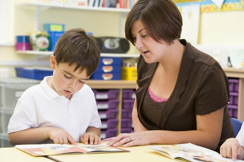 Child learning to read and literacy skills with ASD