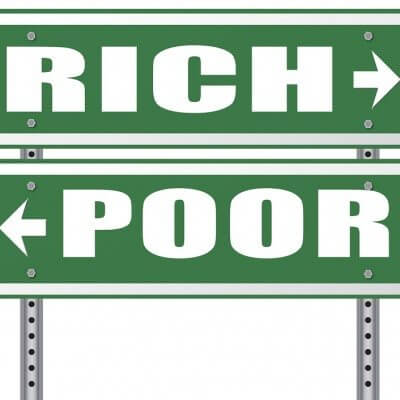 rich or poor take financial risk live in wealth good or bad luck and change fortune wealthy or poverty road sign arrow